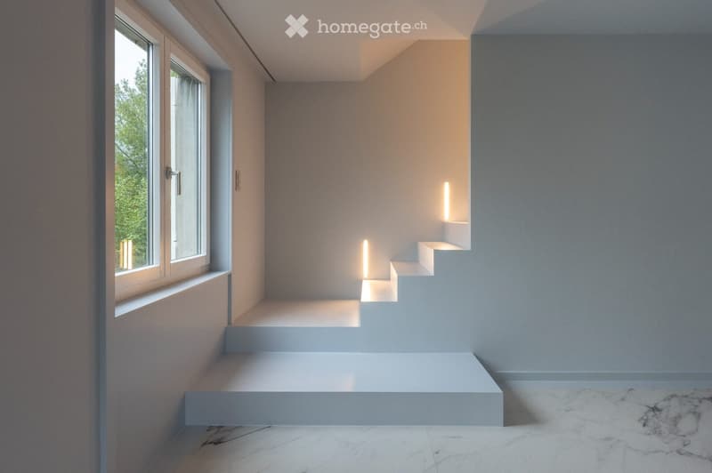 Completely empty room with bare walls and marble flooring. No furniture or equipment.