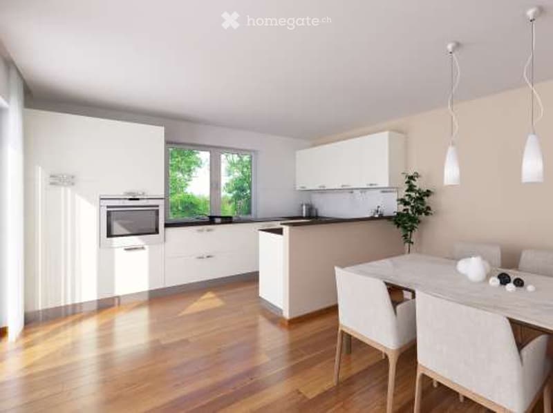 Modern kitchen with white cabinets, stainless steel oven, central island, dining area with table and chairs, pendant lights, and a small plant.