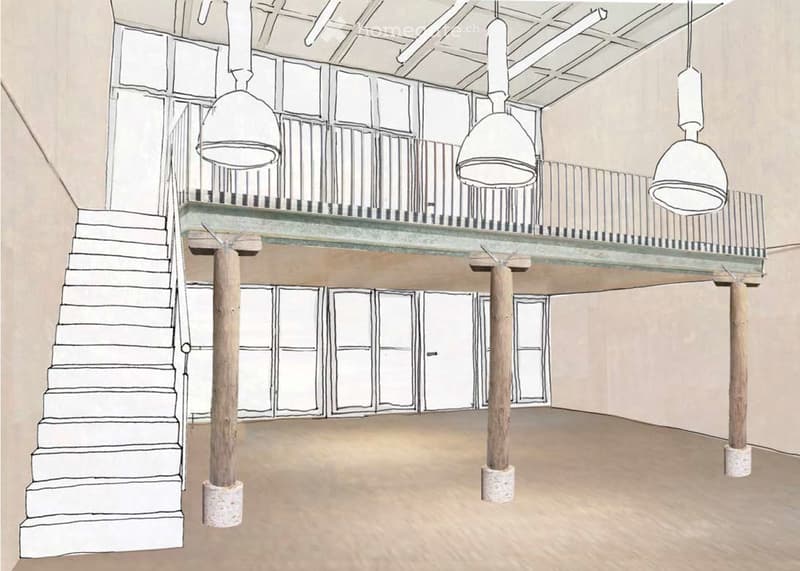 Floor plan of a spacious interior with a staircase leading to an upper level, supported by wooden columns, and large windows on the upper level.