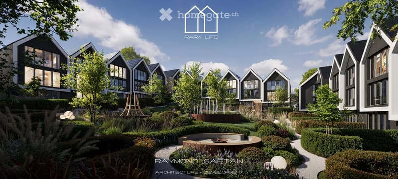 A modern residential complex with contemporary houses featuring large windows and pitched roofs, surrounded by landscaped gardens and pathways.