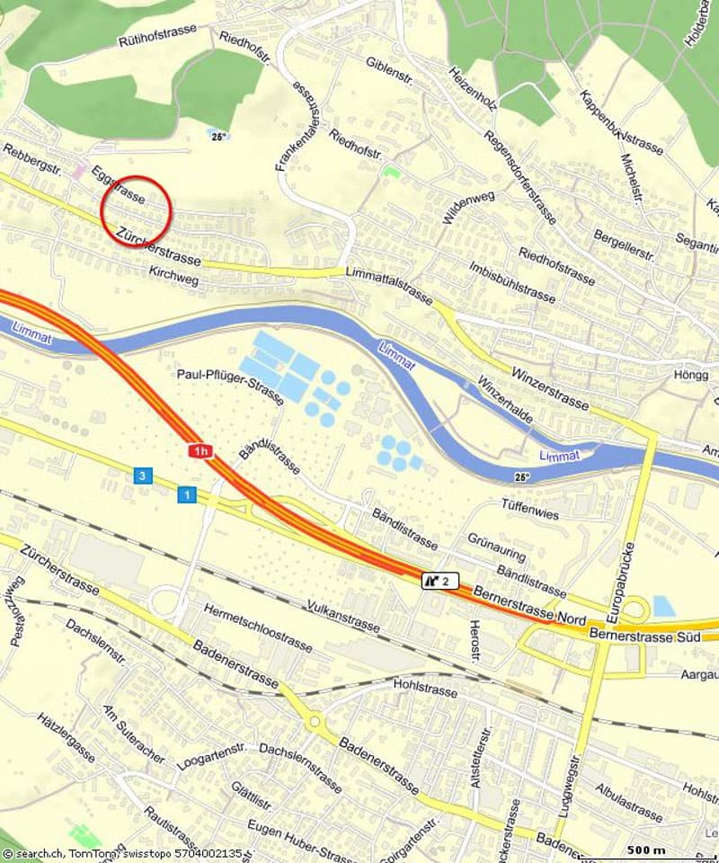 The map shows a road network with street names, including Limmatstrasse, Vulkanstrasse, and Bahnstrasse. There are numbered road signs (e.g., '1h', '2', '3') and a blue and red circle highlighting a specific location, possibly an intersection or a point o