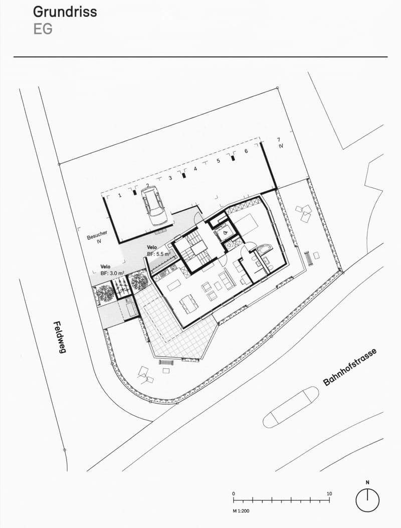 Ground floor layout showing entrance, living area, kitchen, bedrooms, bathrooms, and parking spaces.