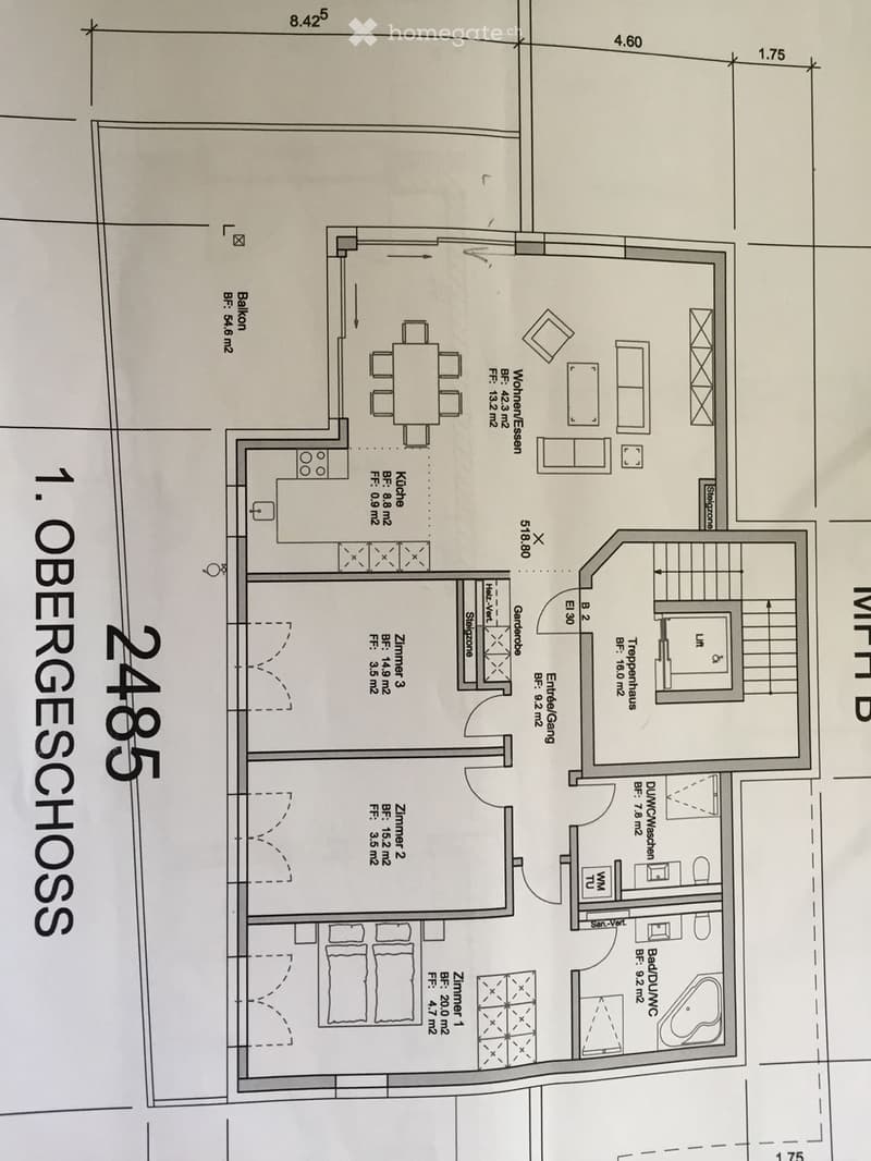 Floor plan of a residential unit labeled 'OBERGESCHOSS' showing multiple rooms including living spaces, bedrooms, kitchen, bathrooms, and a balcony.