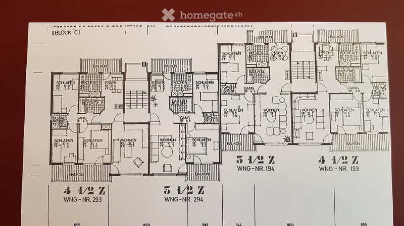 Floor plan showing multiple apartments with labeled rooms including living areas, bedrooms, kitchens, bathrooms, and balconies.