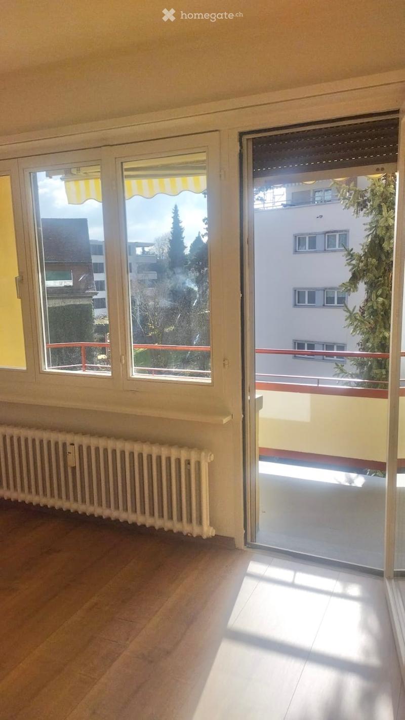 large windows, balcony, radiator, wooden floor