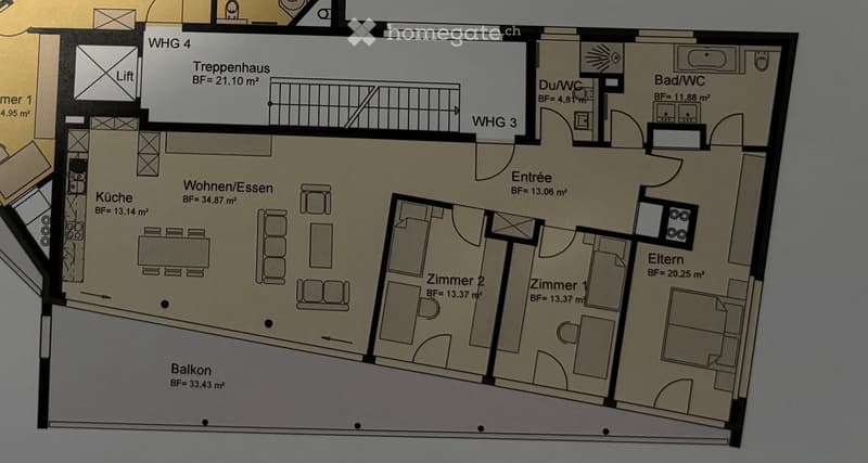 Floor plan of a multi-unit building showing four apartments, including a kitchen, living/dining area, two bedrooms, a bathroom, and a balcony.