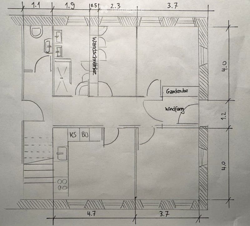 Floor plan of a small apartment with a living room, kitchen, bathroom, and balcony access.