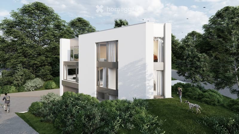 Modern two-story house with white exterior, large windows, and a raised ground floor. The house features a balcony and is surrounded by greenery and a well-maintained lawn.