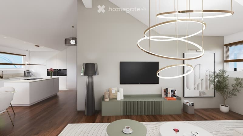 Modern living and dining area with a sleek, multi-tiered circular light fixture, a flat-screen TV mounted on the wall, a tall floor lamp, a kitchen island with bar stools, and a small coffee table with a cup on it.