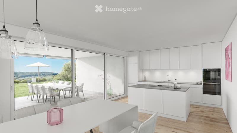 Modern kitchen with white cabinets, island, dining area, and large windows offering a scenic view of the landscape.