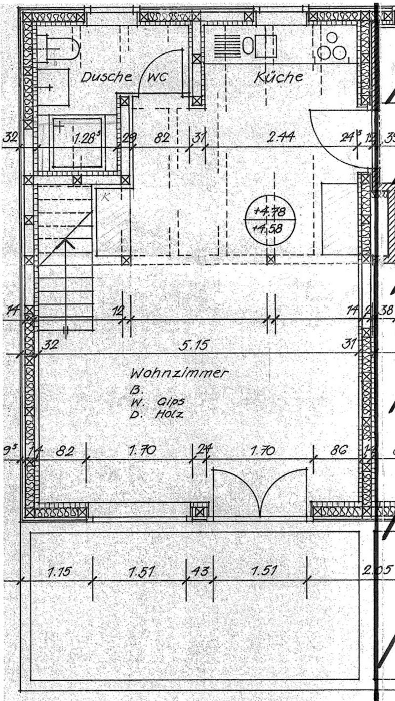 Floor plan showing a bathroom, kitchen, and living room with dimensions and material notes.