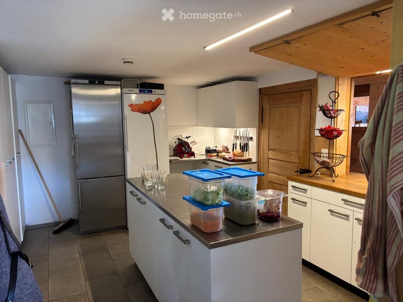{"type": "Kitchen", "objects": ["refrigerator", "cabinets", "countertop", "storage containers", "flower", "faucet", "cutting board", "knives", "cupboard", "fridge", "cup", "bowl", "fridge", "cupboard", "cupboard", "cupboard", "cupboard", "cupboard", "cupb