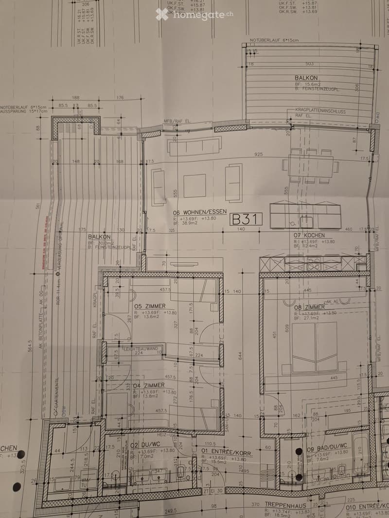 Floor plan showing a residential unit with living/dining area, kitchen, bedrooms, bathrooms, and balcony.