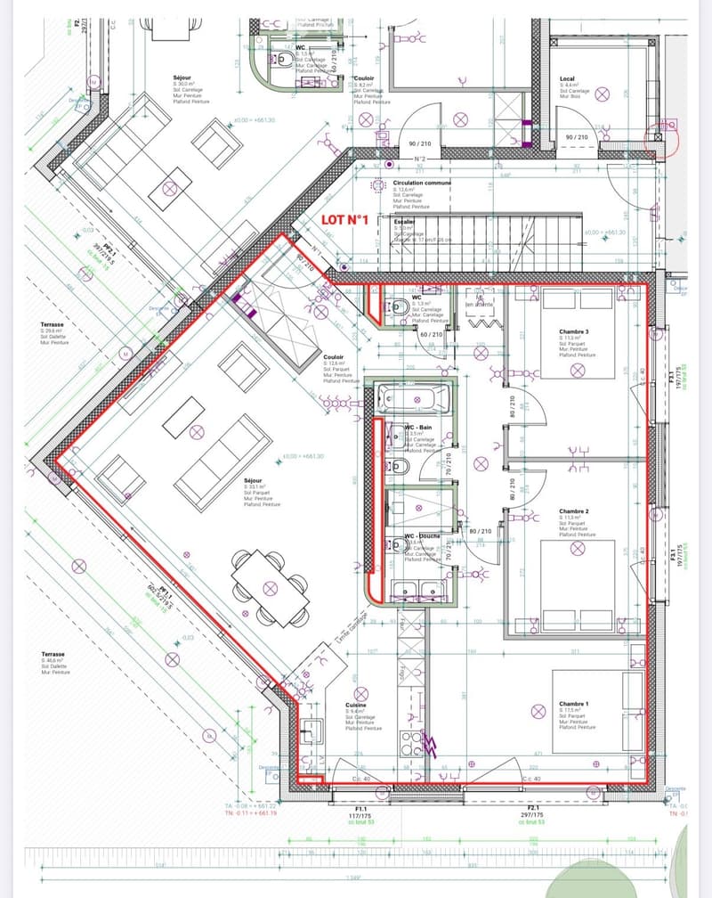Floor plan of a residential unit labeled 'LOT N° 1' showing multiple rooms including living room, kitchen, bedrooms, bathrooms, and a terrace.