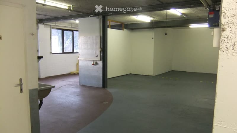 Empty room with bare walls, concrete floor, and a single window. No furniture or equipment present.