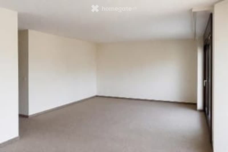Completely empty room with bare walls and carpeted floor. No furniture or equipment.