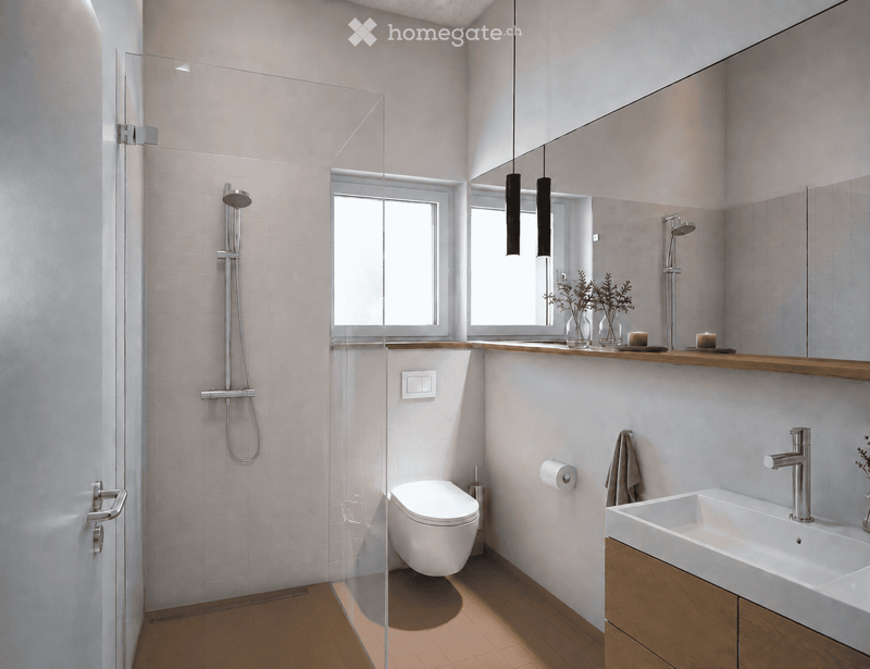 Modern bathroom with white tiles, wooden floor, glass shower enclosure, toilet, sink, and decorative items on the vanity.
