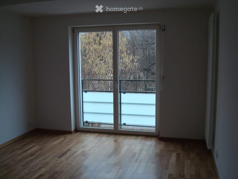 wooden floor, sliding glass doors, balcony, trees outside