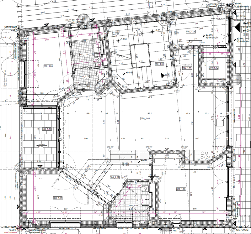 Floor plan of a residential building showing multiple rooms, hallways, and structural elements with labeled dimensions and room numbers.