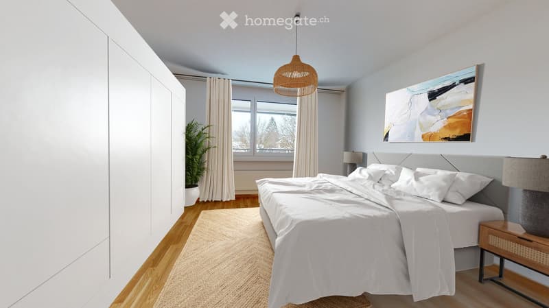 Modern bedroom with a large bed, nightstand, lamp, painting, plant, and wardrobe. Light-colored decor with wooden flooring.
