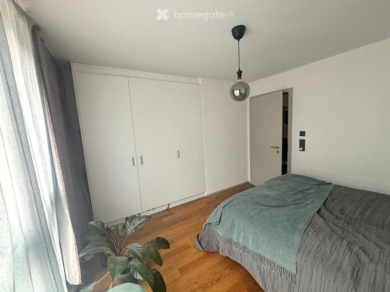 room with bed, closet, and window