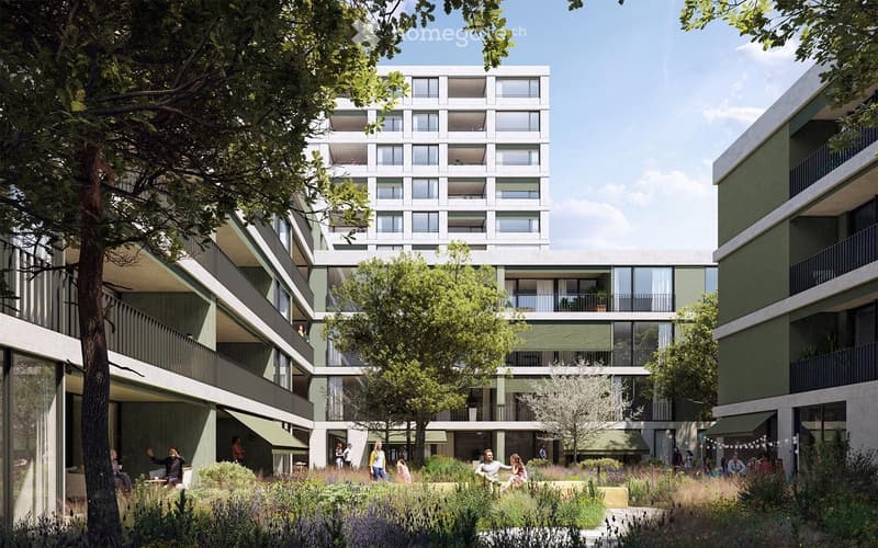 Modern multi-story residential building with green balconies and a landscaped garden area in front.