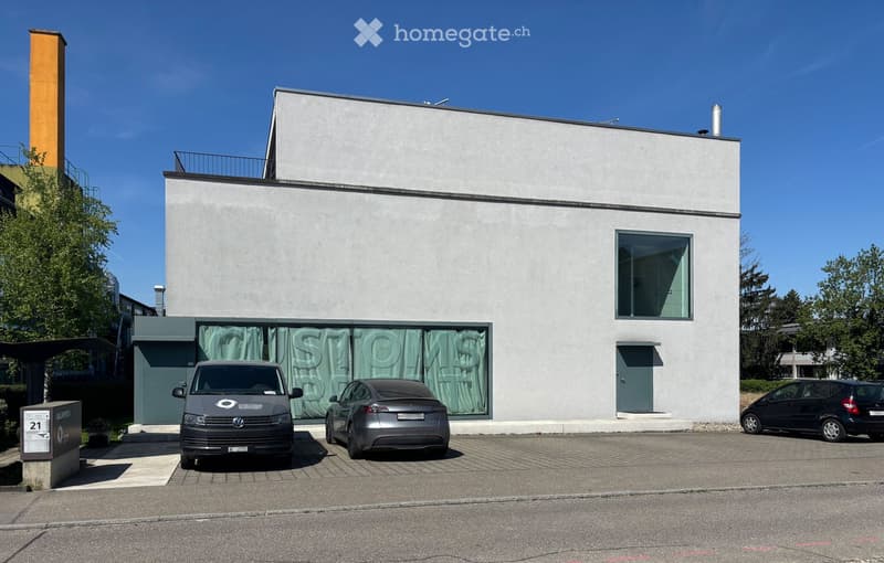 modern design, white exterior, large windows, balcony, parking area