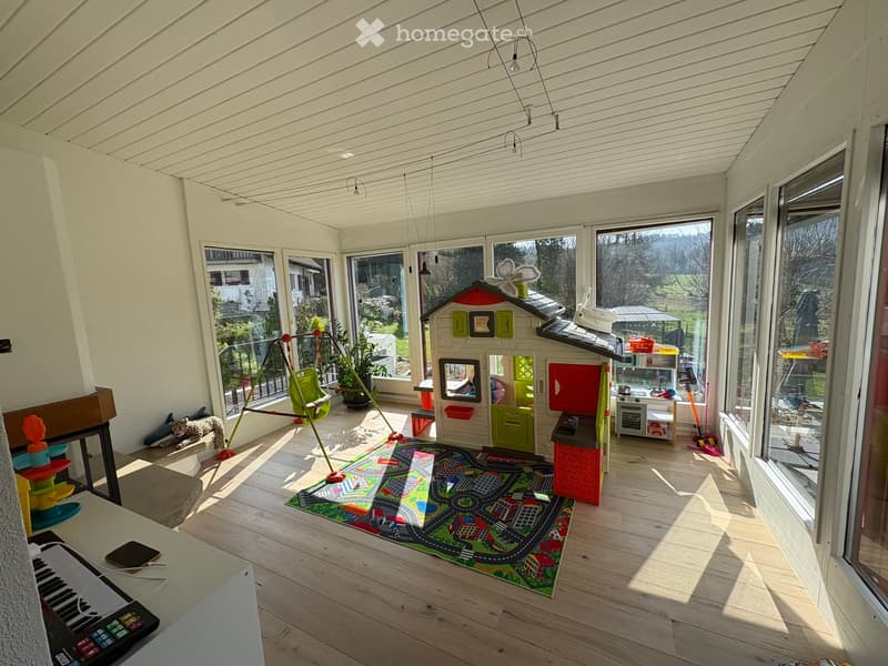 {"type": "Furnished Room", "objects": ["toy house", "toy kitchen", "toy stove", "toy refrigerator", "toy sink", "toy oven", "toy microwave", "toy table", "toy chair", "toy swing", "toy piano", "toy car track", "toy car", "toy animal", "toy chair", "toy ta