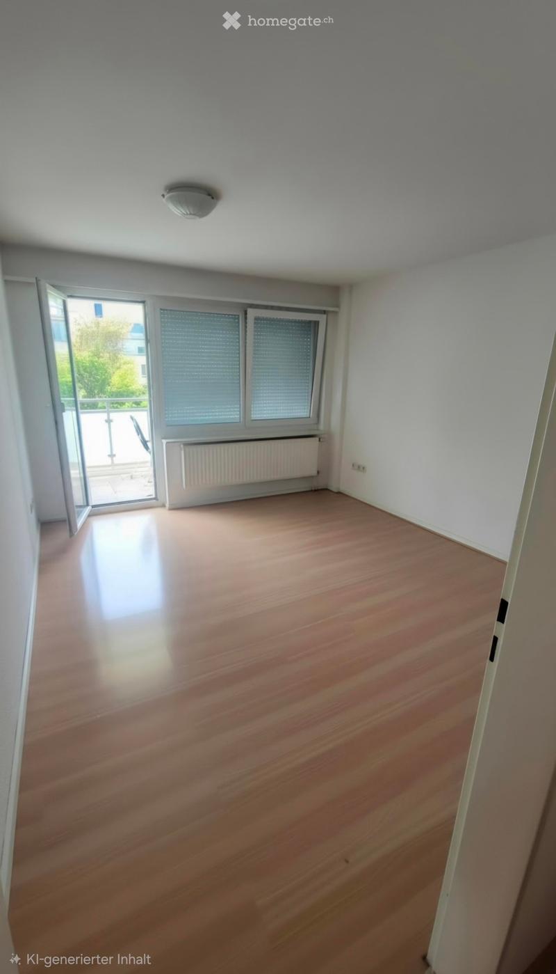 Empty room with wooden flooring, white walls, large windows, and a sliding door leading to a balcony.