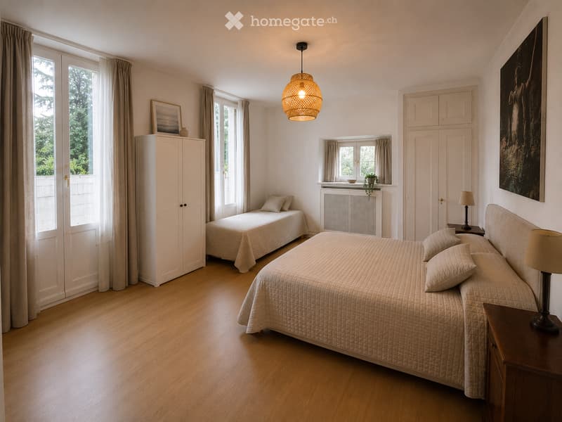Bright bedroom with two single beds, nightstands, lamps, a large cabinet, and a pendant light. Large windows with curtains provide natural light.