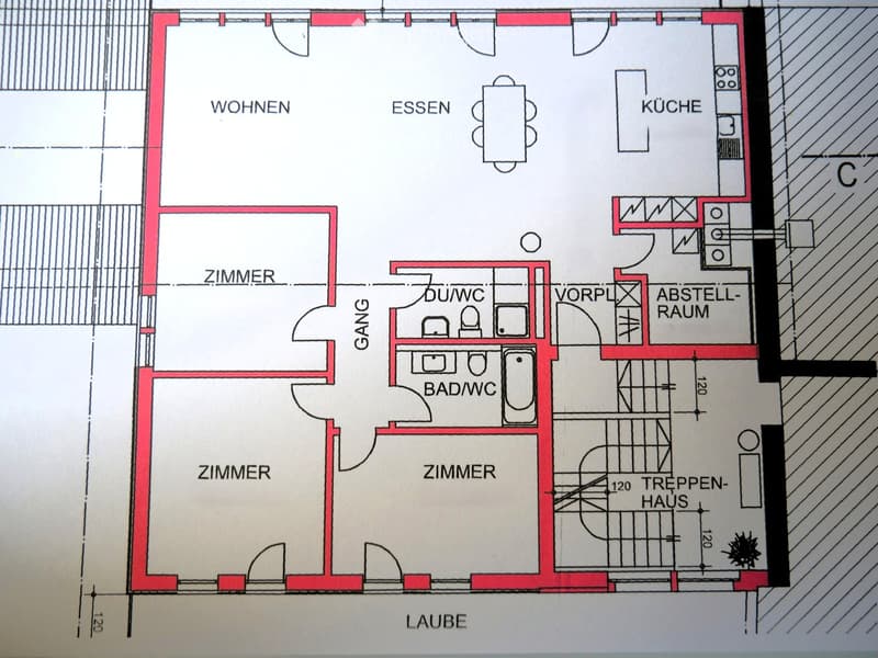 Floor plan showing a layout with living room, dining area, kitchen, three bedrooms, bathroom, hallway, storage room, and staircase.