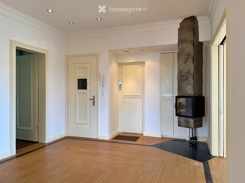 wooden floor, white walls, two doors, one with a window, a fireplace, modern style