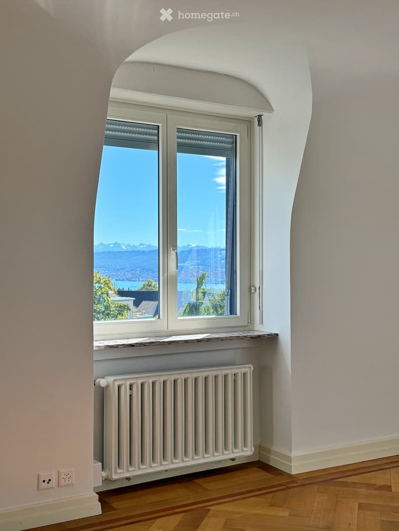 arch window, white wall, white radiator, wooden floor, outlet