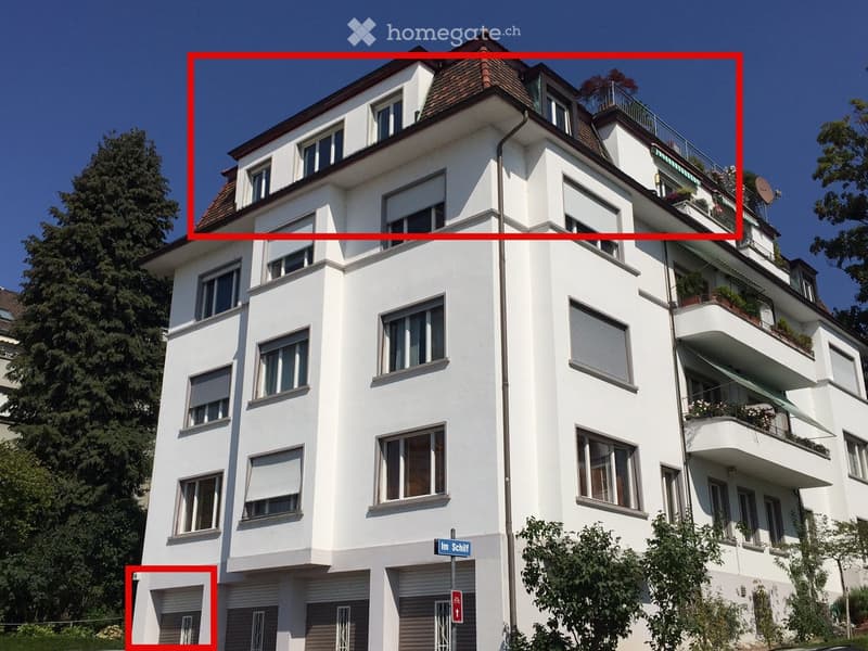 White painted building, several windows, balconies, and red-highlighted sections