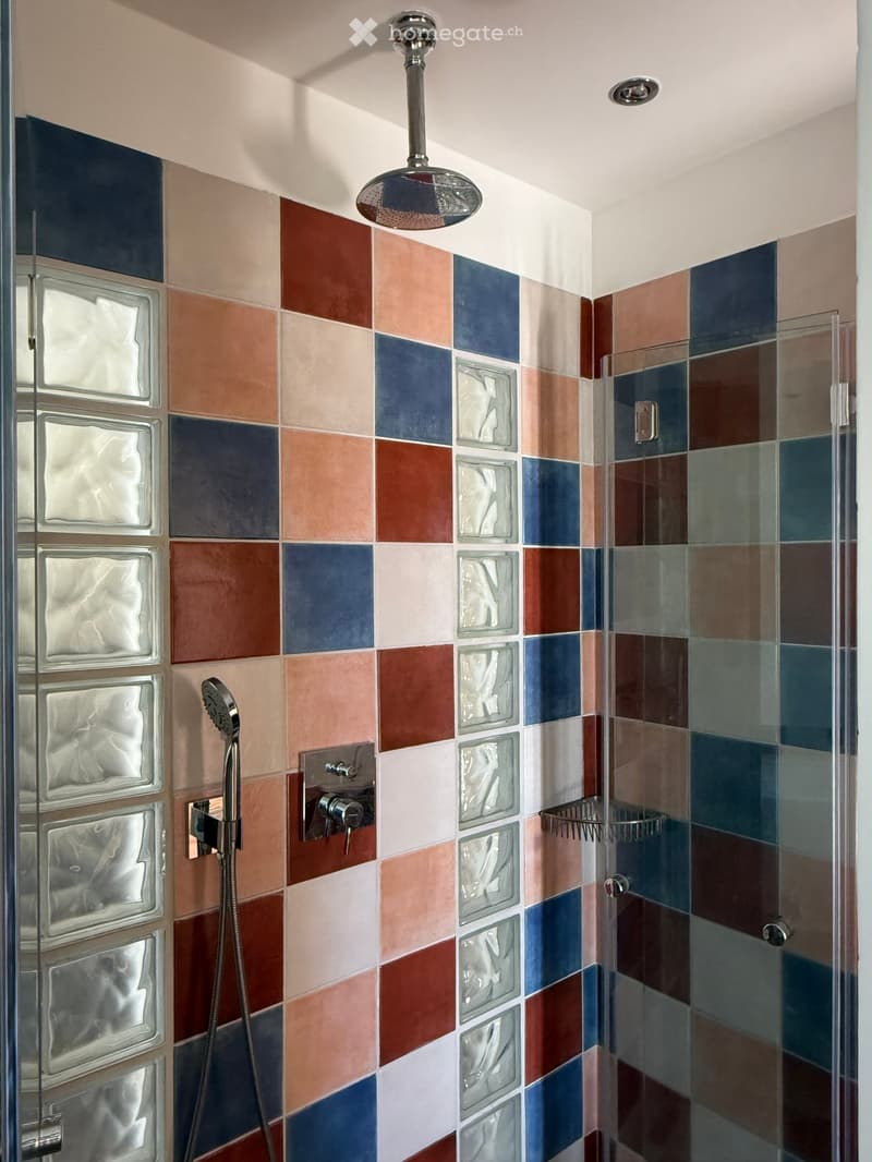 Colorful square tile shower, transparent glass shower door, chrome shower head and faucet, built-in glass shelf, modern design