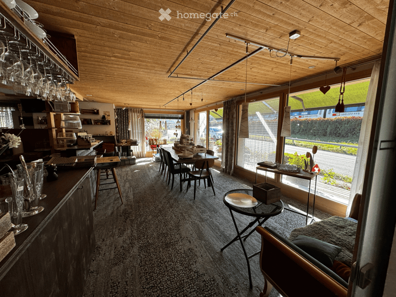 {"type": "Furnished Room", "objects": ["bar counter", "wine glasses", "table", "chair", "stool", "cupboard", "kitchen counter", "stool", "table", "chair", "cupboard", "stool", "stool", "stool", "stool", "stool", "stool", "stool", "stool", "stool", "stool"