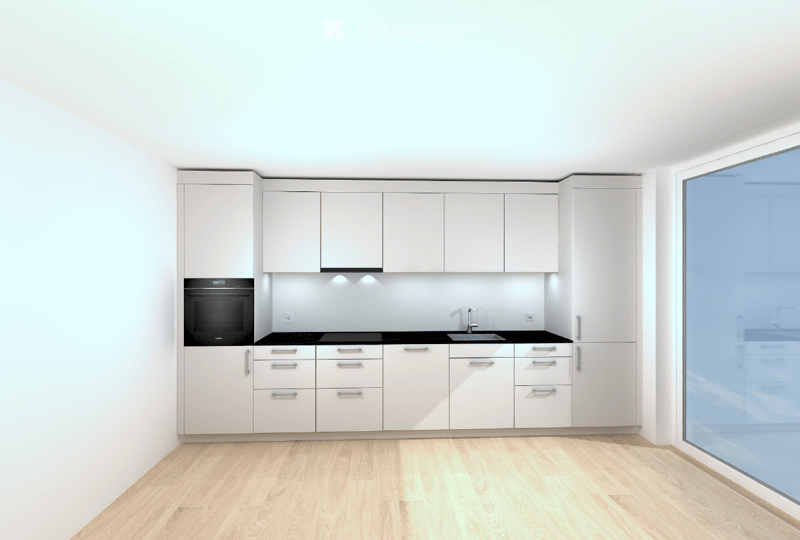 Modern kitchen with white cabinets, black countertops, and a large window. Features include an oven, sink, and ample storage space.