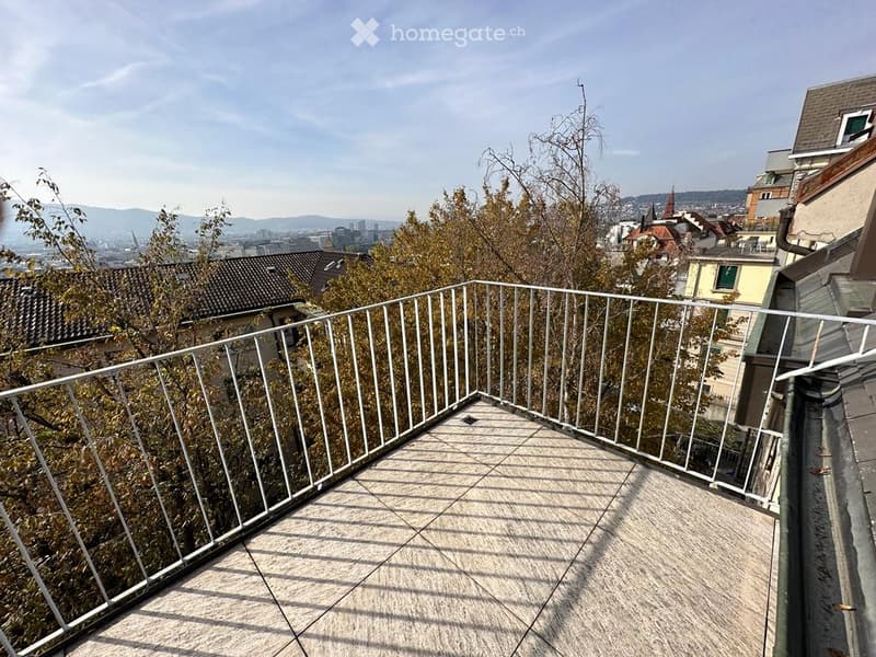 Balcony with metal railings, tiled floor, unobstructed city view