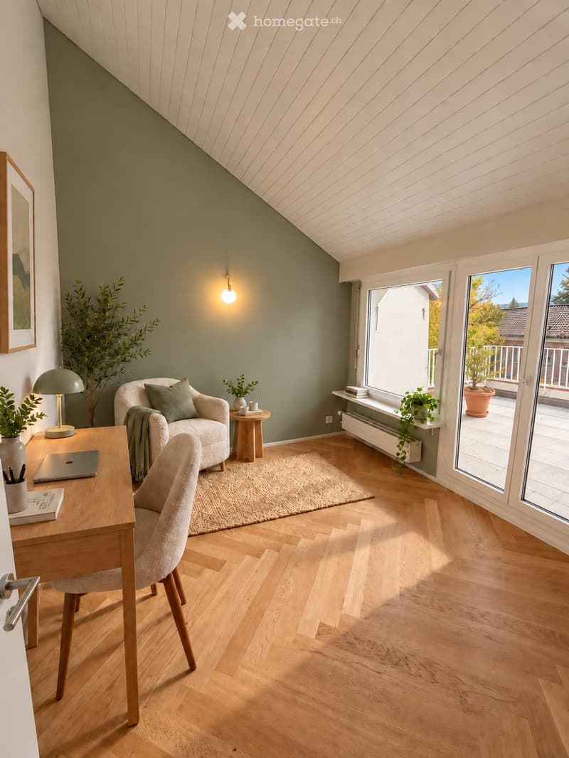 Bright, modern room with wooden flooring, large windows, and a balcony. Features a sofa, armchair, small table, desk with laptop, and decorative plants.