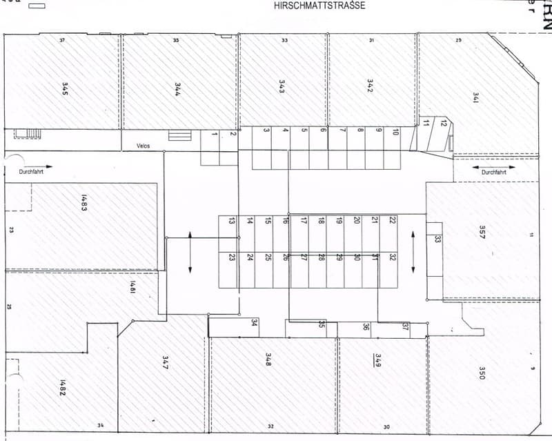 Floor plan of a building labeled "Hirschmattstrasse" showing multiple rooms and numbered sections, including a designated area for bicycles (Velos) and access points (Durchfahrt).
