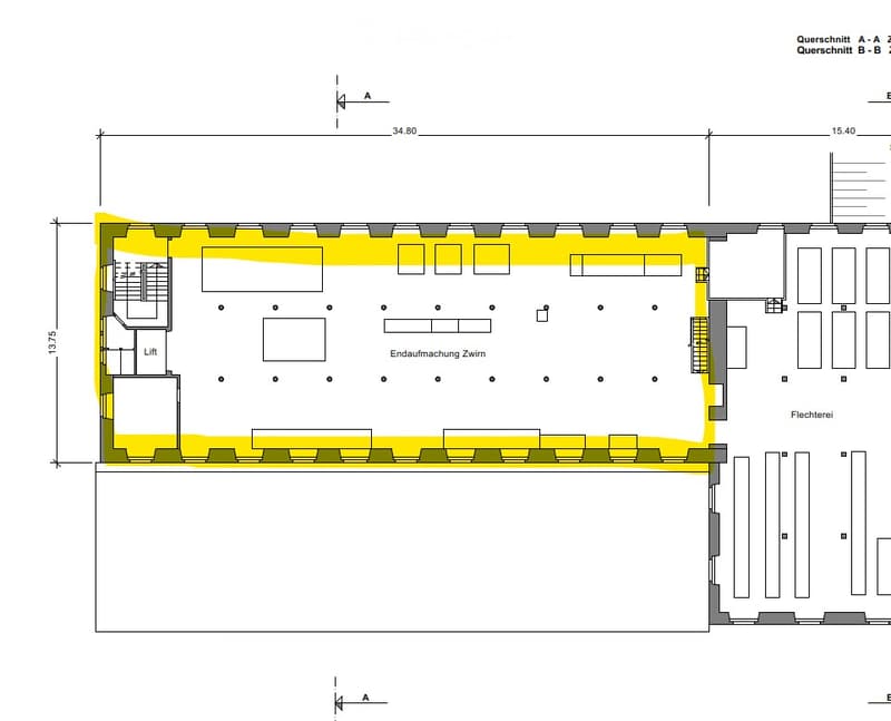 Floor plan of a building with multiple rooms, including a lift, storage area, and several rectangular spaces.