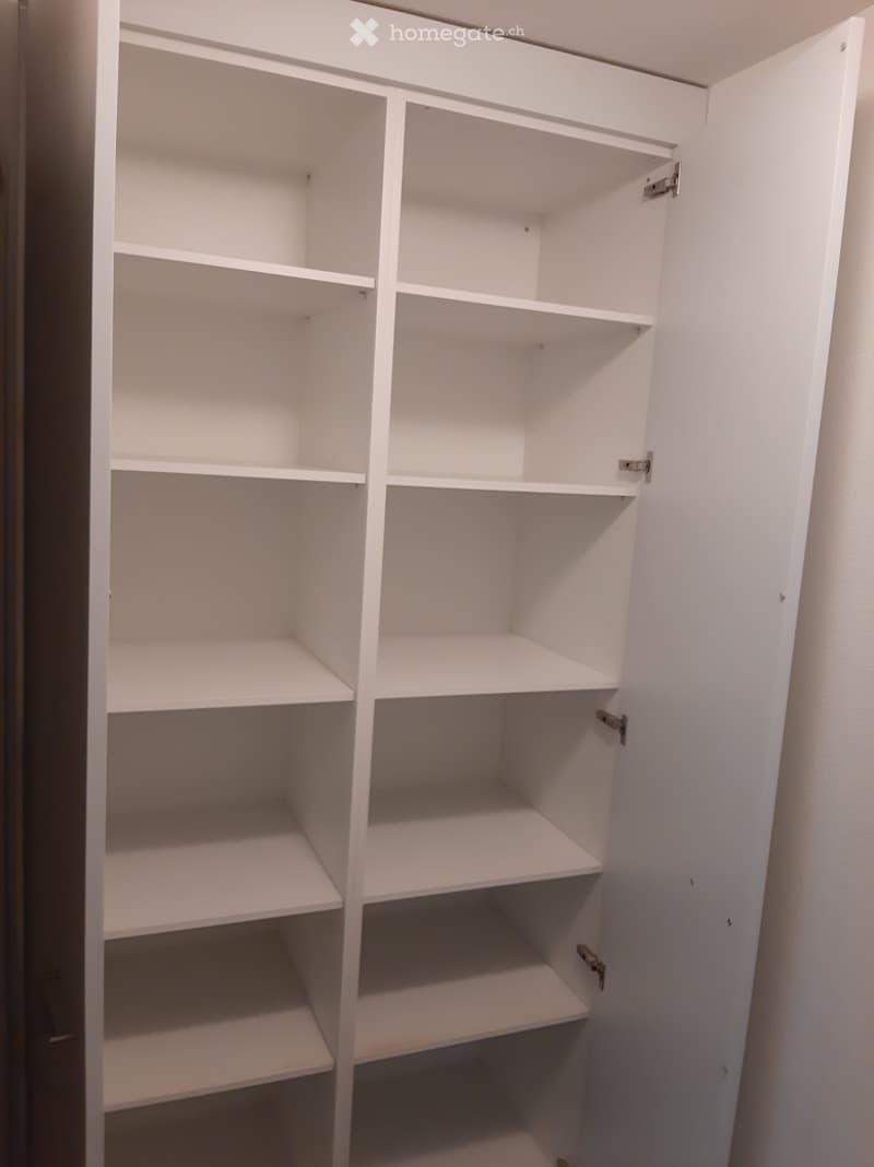 white wooden shelves, empty