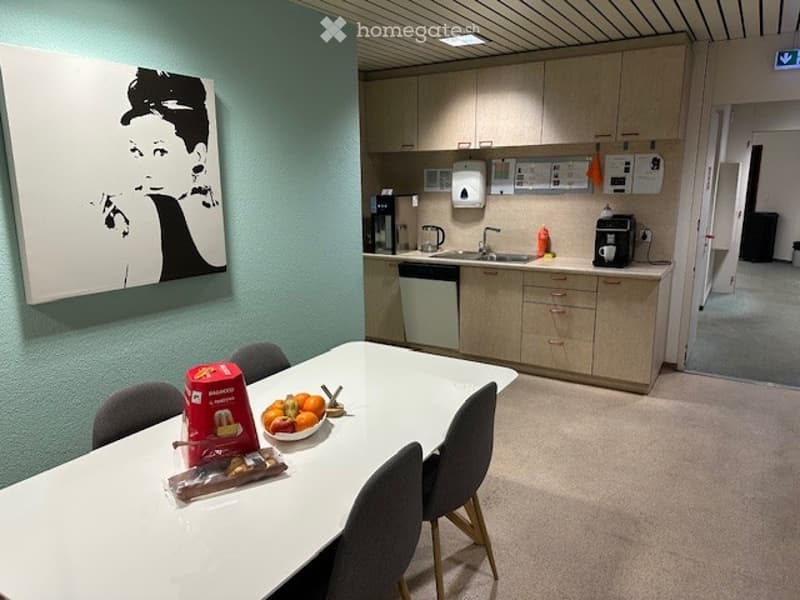 dining table with chairs, bowl of fruit, artwork, kitchen, sink, dishwasher, cabinets