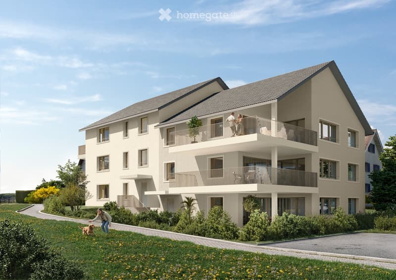 Modern two-story residential building with balconies, large windows, and a landscaped garden area.