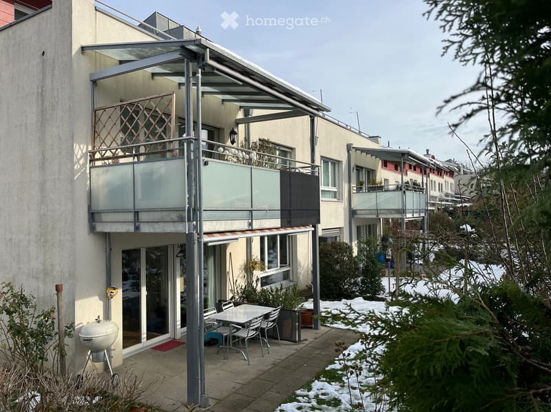 Apartment building, exterior, glass balcony, awning, outdoor seating, BBQ grill, snow-covered ground
