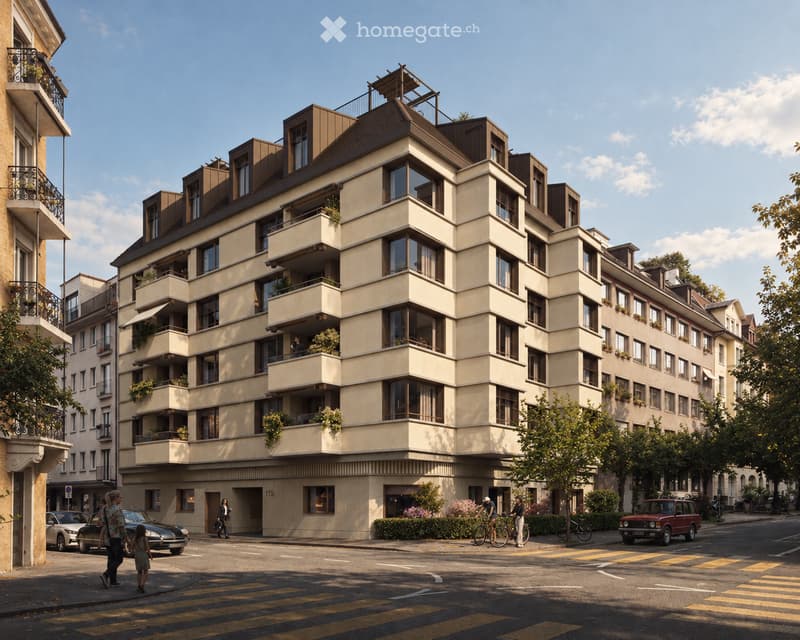Modern multi-story residential building with balconies and large windows, located on a street with pedestrians and parked cars.