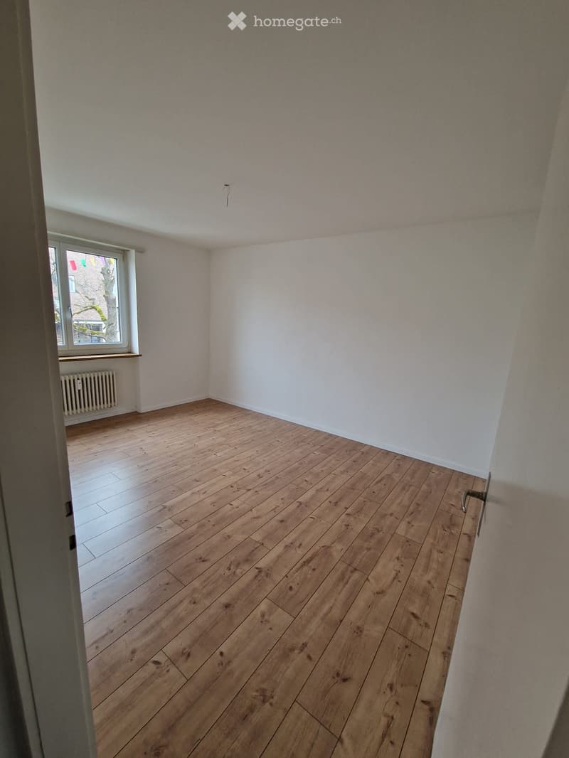 empty room, hardwood floor, window, radiator