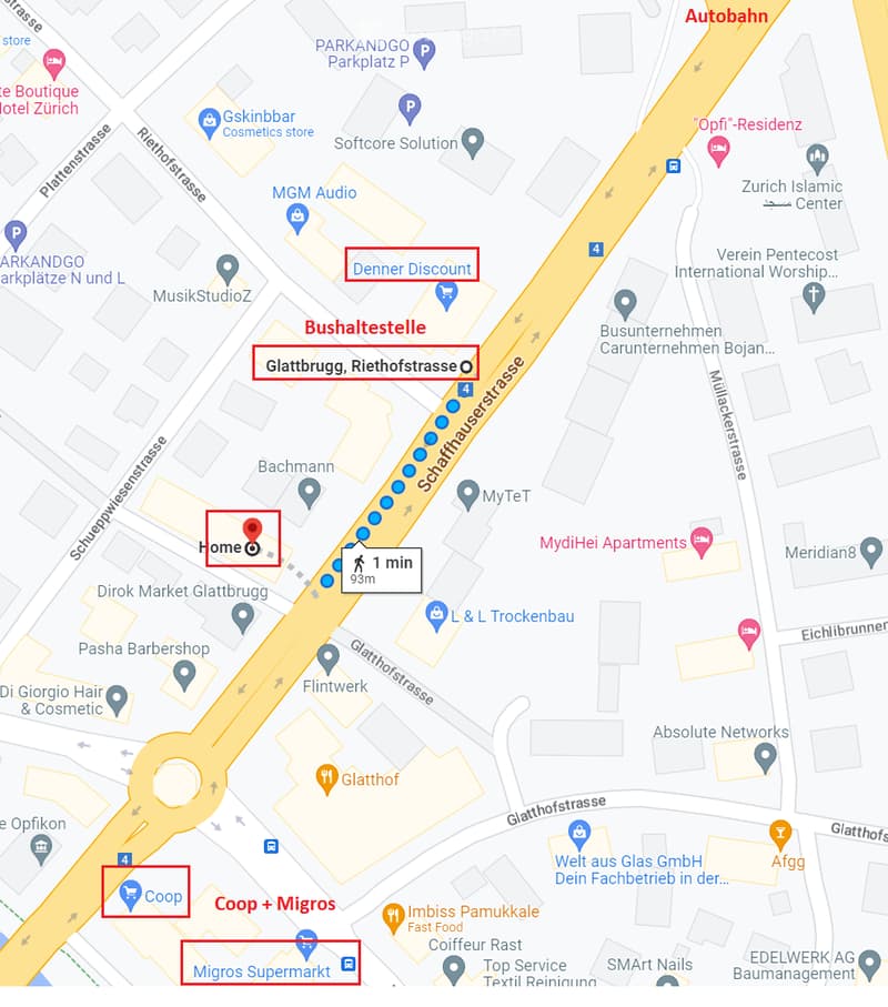 Map view showing a residential area with streets, buildings, and nearby amenities such as shops, a bus stop, and parking areas.