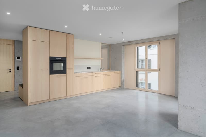 open kitchen with modern cabinets, oven, sink, concrete floor, double glass door
