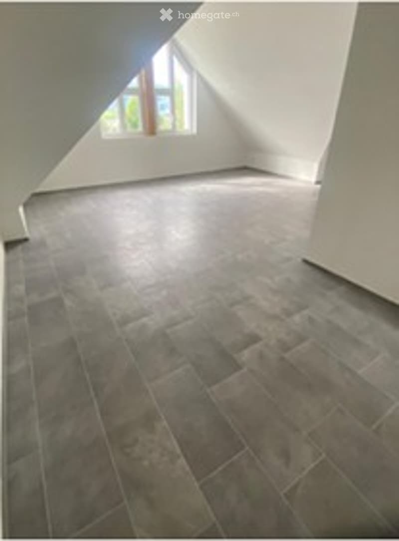 Completely empty room with bare walls and wooden floor. No furniture or equipment.